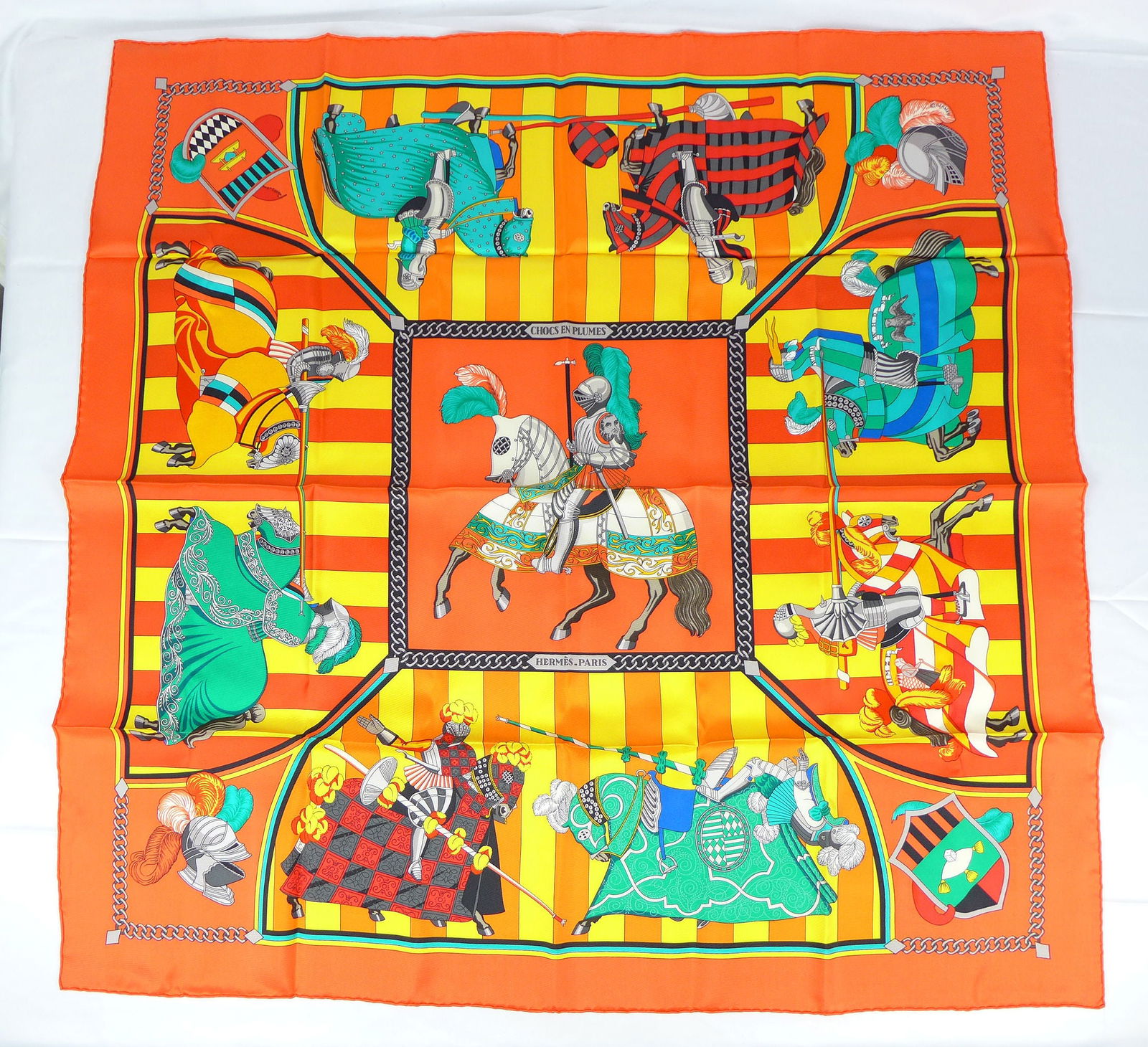 Vintage Hermes Paris Silk Scarf "Chocs en Plumes" with box: This is a classic 90cm Carre Hermes Silk Scarf made in Paris dating from the late 80's or 90's. Titled "Chocs en Plumes" and is decorated with Armored Knights and horses in competition. It was Designe