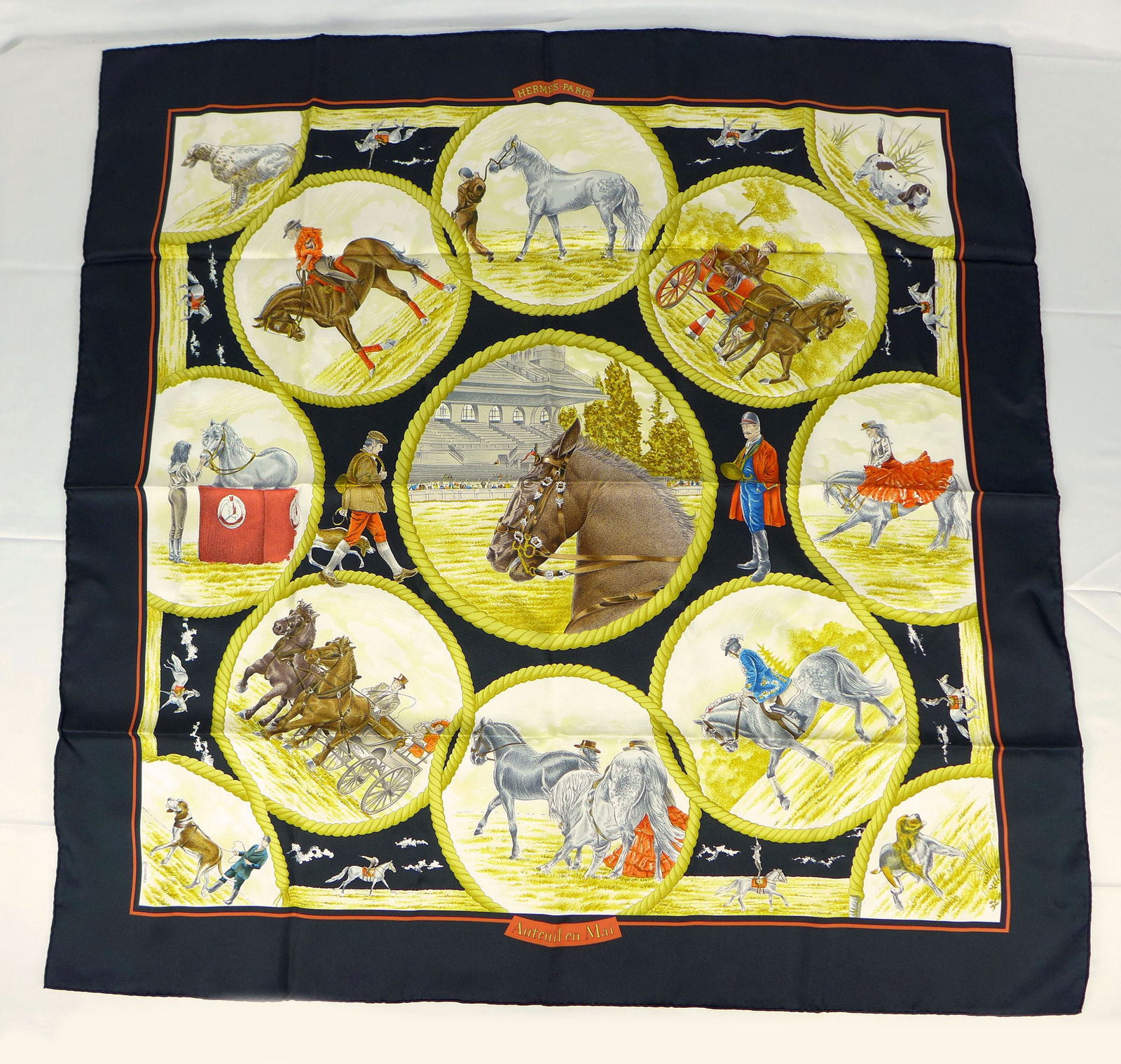 Vintage Hermes Paris Silk Scarf "Auteuilen Mai" with box: This is a classic 90cm Carre Hermes Silk Scarf made in Paris dating from the later 80's or 90's. Titled "Auteuil en Mai" and is decorated cartouches of scenes from the annual horse race/competition th