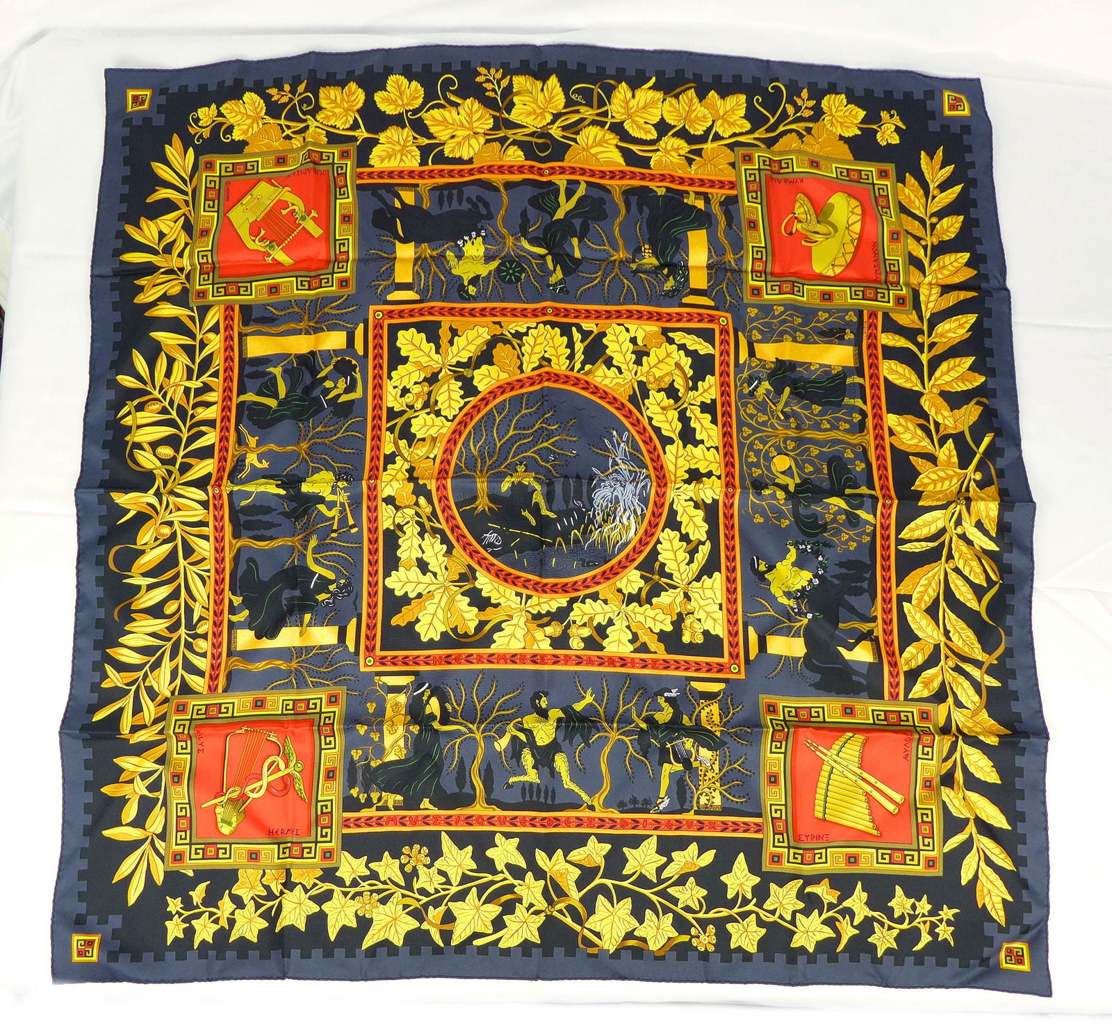 Vintage Hermes Paris Silk Scarf "Musique des Dieux" with box: This is a classic 90cm Carre Hermes Silk Scarf made in Paris dating from the late 80's or 90's. Titled "Musique des Dieux" and is decorated with a Greek figure and musical instrument design. It was De