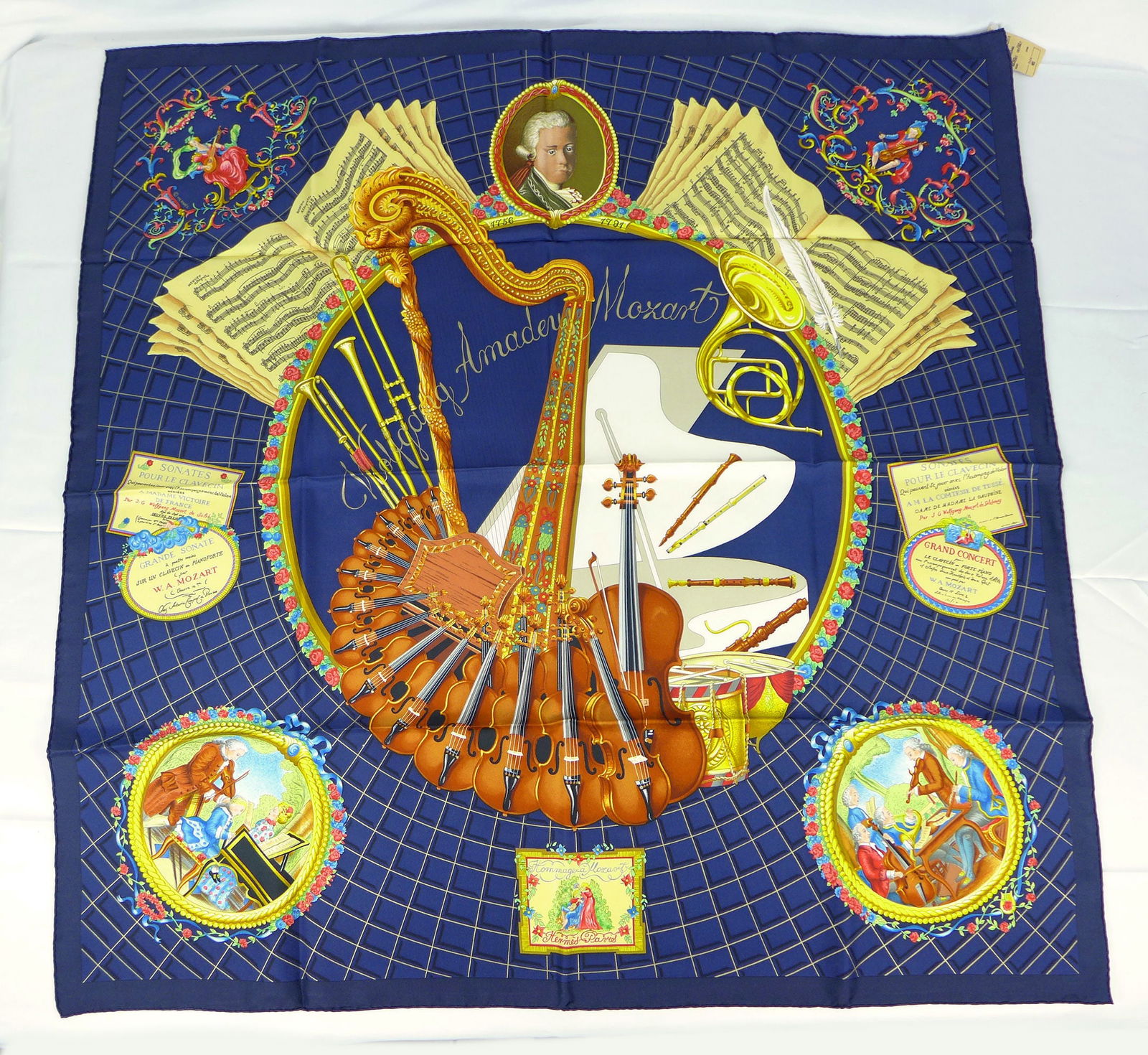 Vintage Hermes Paris Silk Scarf new with tags "Mozart" with box: This is a classic 90cm Carre Hermes Silk Scarf made in Paris dating from the later 80's or 90's. Titled "Mozart" and is decorated with a central portrait of mozart with violins, harps and musical them
