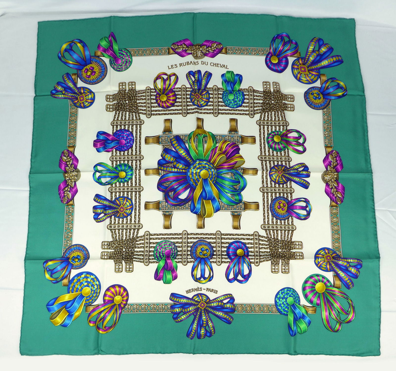 Vintage Hermes Paris Silk Scarf "Les Rubans Du Cheval" with box: This is a classic 90cm Carre Hermes Silk Scarf made in Paris dating from the later 80's or 90's. Titled "Les Rubans Du Cheval" and is decorated with a display of horse award ribbons and chain belts in