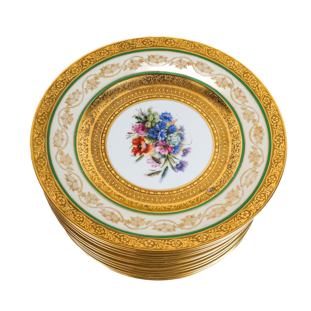 Leroy Bavarian Porcelain Dinner Plates (12): Twelve Leroy Bavarian dinner plates, circa 1900, having gilt relief borders and green bands around paint-decorated floral sprays, marked to bases. [10 5/8" Diam.]. Losses and wear to decoration.