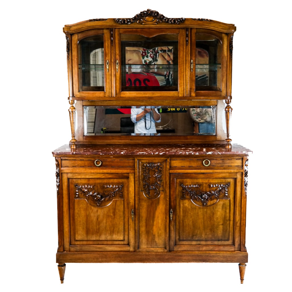 French Antique Carved China Cabinet: French antique carved sideboard china cabinet with marble top and beveled glass. [83" H x 60" W x 20" D]. In good condition.