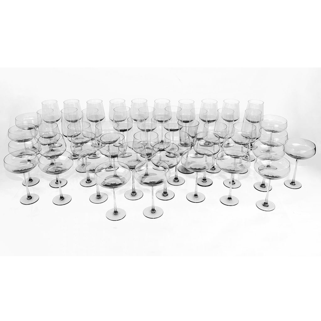 Calvin Klein Group of Glass Stemware (40+): 40+ pieces of Calvin Klein stemware in clear to green glass, including red wine, white wine and water glasses and champagne saucers. Provenance: From the Collection of renowned architect and designer