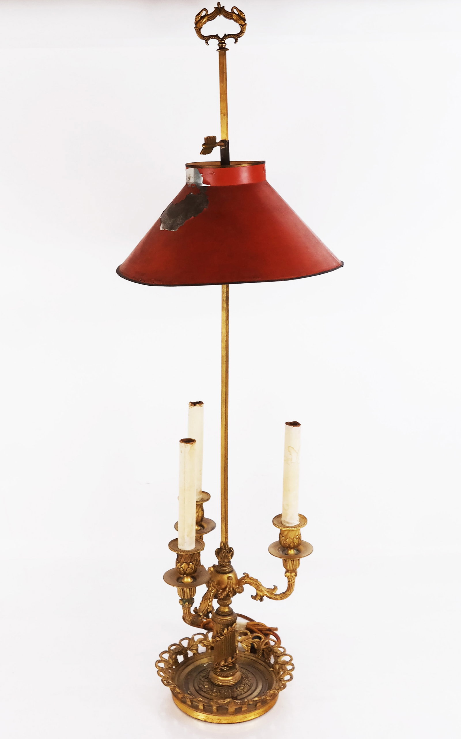 Louis XVI-Style Gilt Bronze Bouillotte Lamp: Louis XVI-style gilt bronze bouillotte lamp, late 19th or early 20th century, having a tole shade above three upswept foliate-accented arms and a round base. [39" H x 9 1/2" Diam.]. Later electrified.