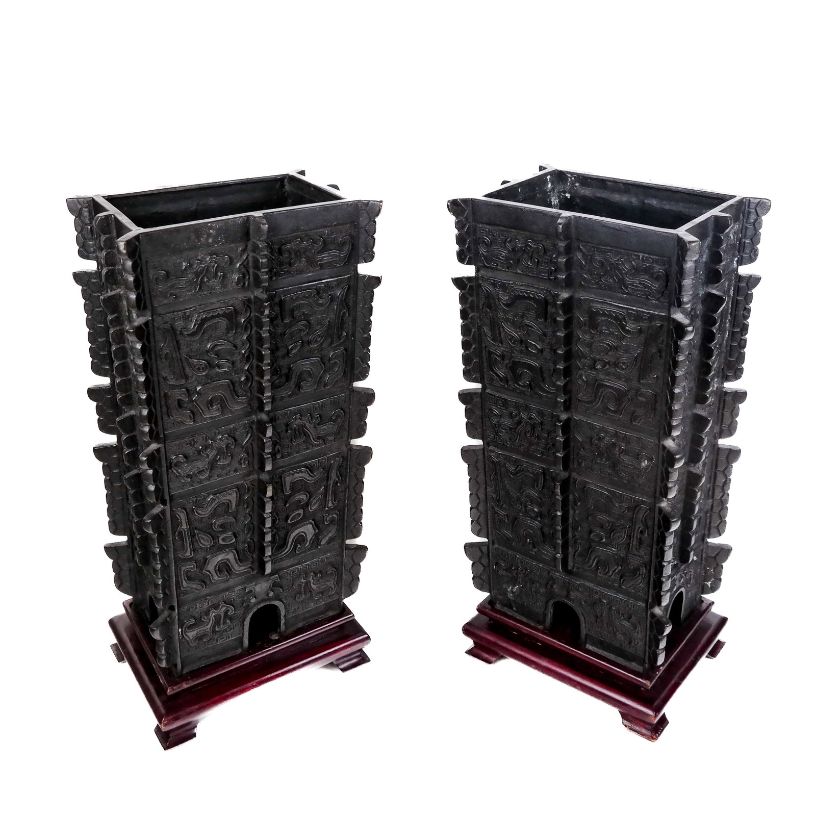 Large Pair of Chinese Patinated Bronze Vases: Large pair of Chinese patinated bronze vases, late 20th century, modeled as archaic wine vessels with relief details. [15 3/4" H x 8 3/4" W x 6 1/4" D].