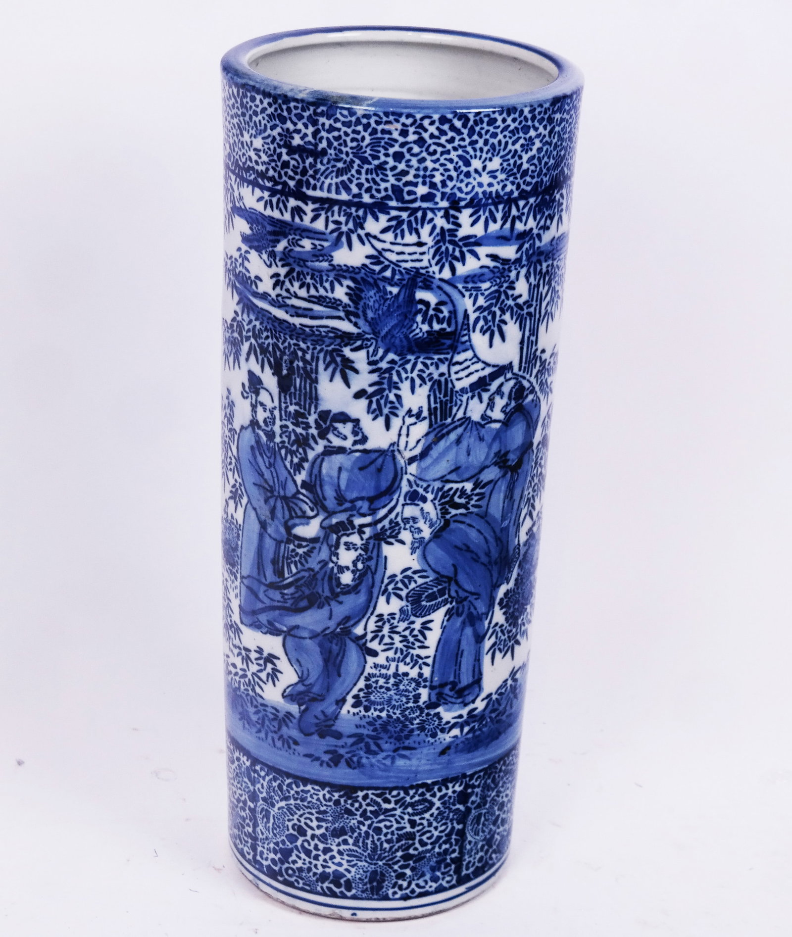 Chinese Blue & White Porcelain Umbrella Stand: Chinese blue and white porcelain umbrella stand of cylindrical form, depicting figures in a landscape with foliate bands. [28 18" H x 9 1/2" Diam.].