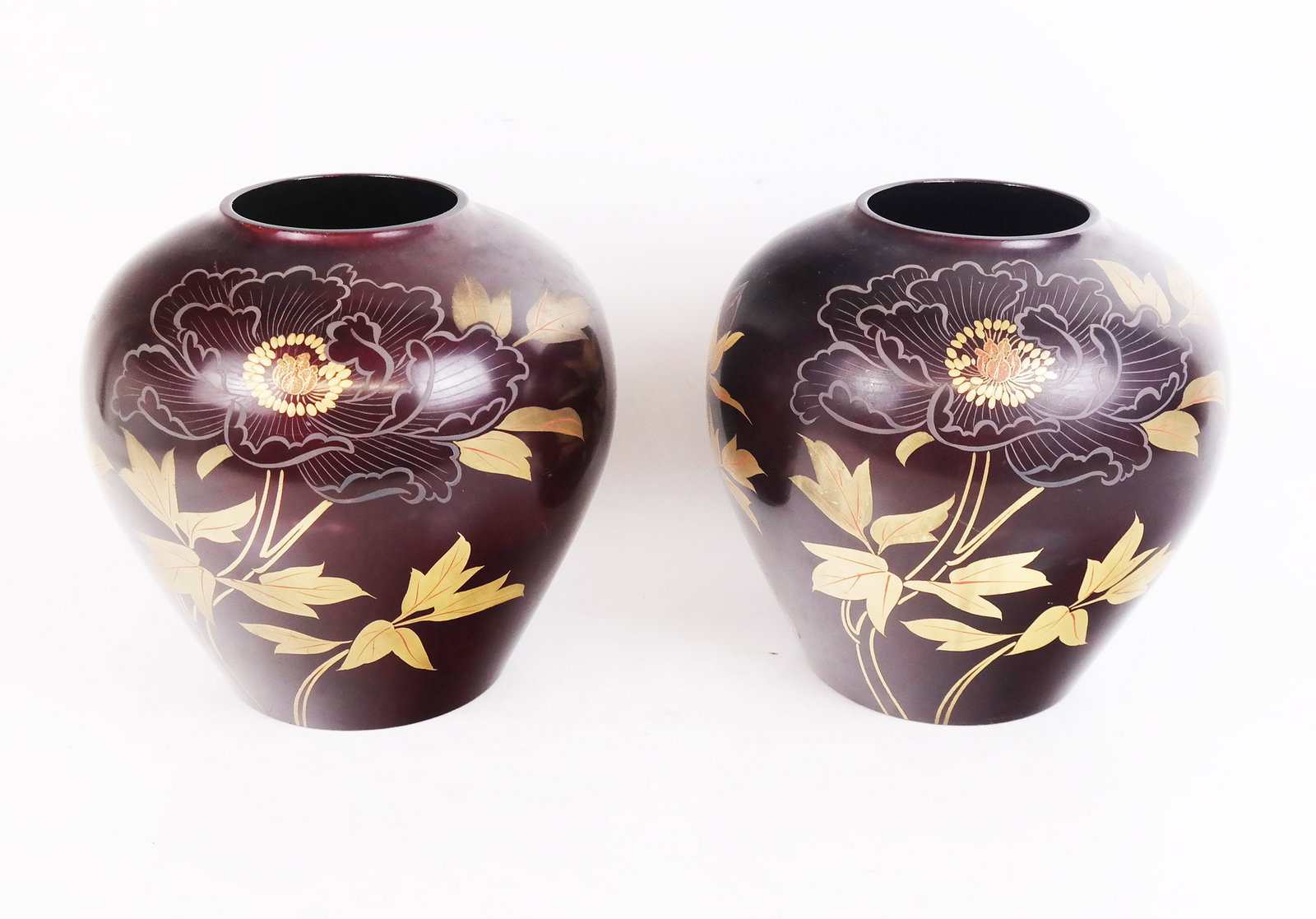 Pair of Japanese Gilt Metal Vases: Pair of Japanese gilt metal vases, the brownish-red ground decorated with peonies, signed to bases. [9" H x 9" Diam.].