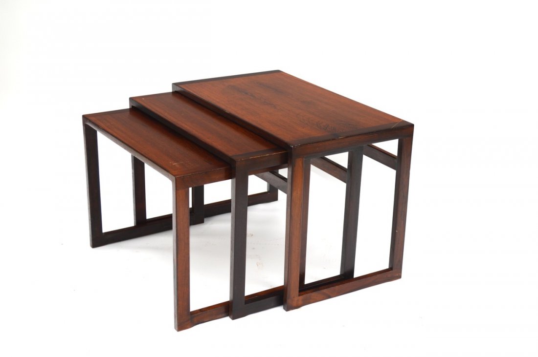 Set of Three Danish Nesting Tables: Rosewood tables with matched grain tops. Stamped "Made in Denmark" on bottoms. Few minor scratches, otherwise in good condition. Largest: 24 1/2" W x 13 1/2" D x 16 1/2" H.