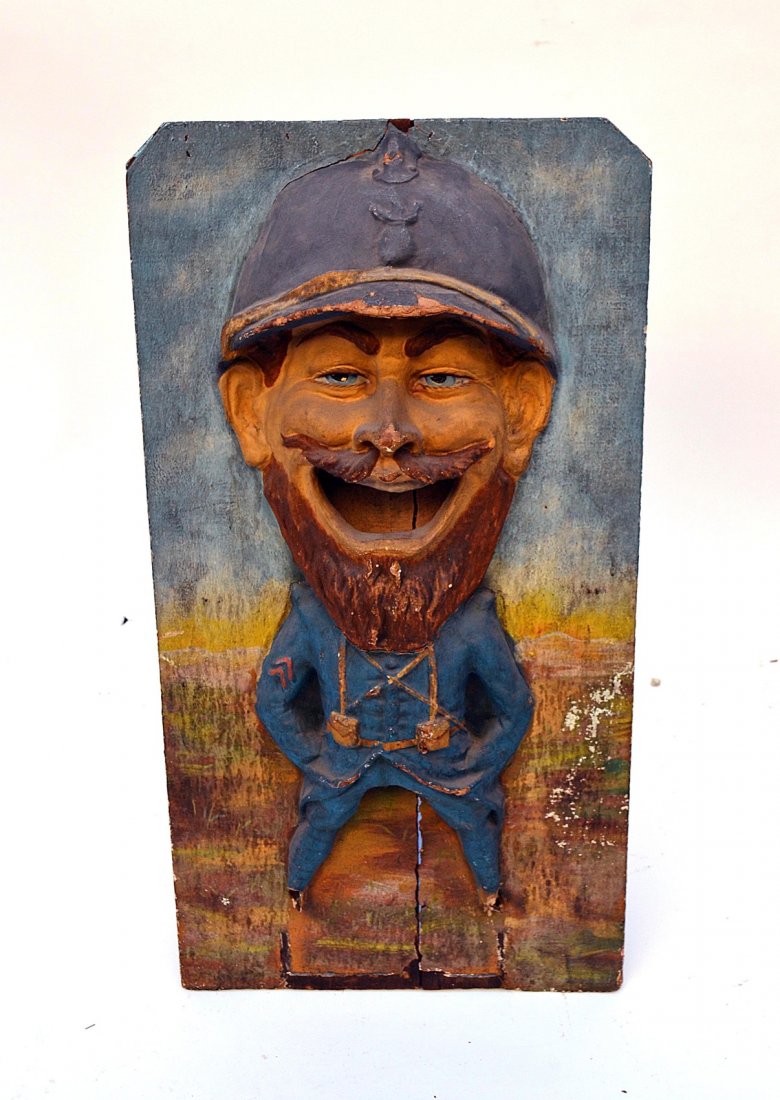 Vintage Papier Mache Carnival Dummy Board: Whimsical high relief depiction of a uniformed man with caricature smiling expression. 17 1/2" W x 5" D x 33 1/2" H. Mounted on board. As is, cracking, losses to feet, and paint flaking.