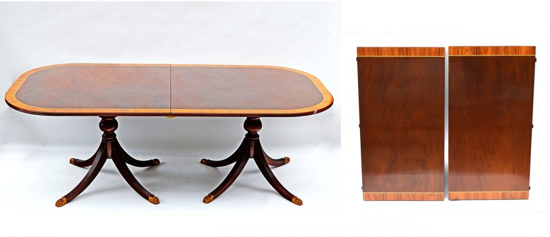 Sheraton Style Dining Table: Mahogany banded double pedestal with leaves. 86" x 44" x 30"H. Some scratches.
