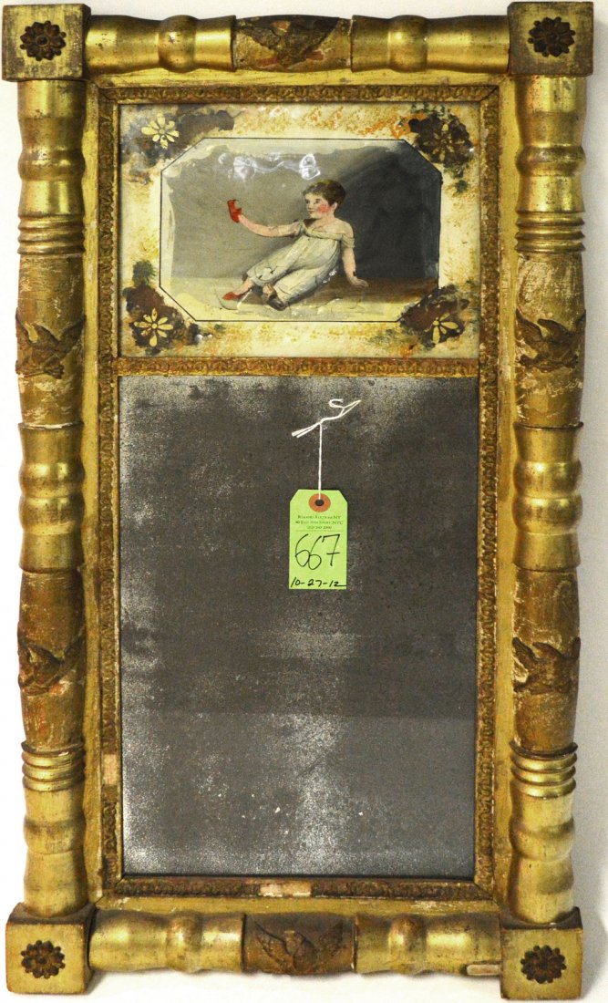 Antique American Trumeau Mirror: Bears turned gilt wood surround with eagle accents. Features a verre eglomise panel at top depicting a child removing its shoes. As is, painted panel bears flaking with losses as well as frame. Panel: