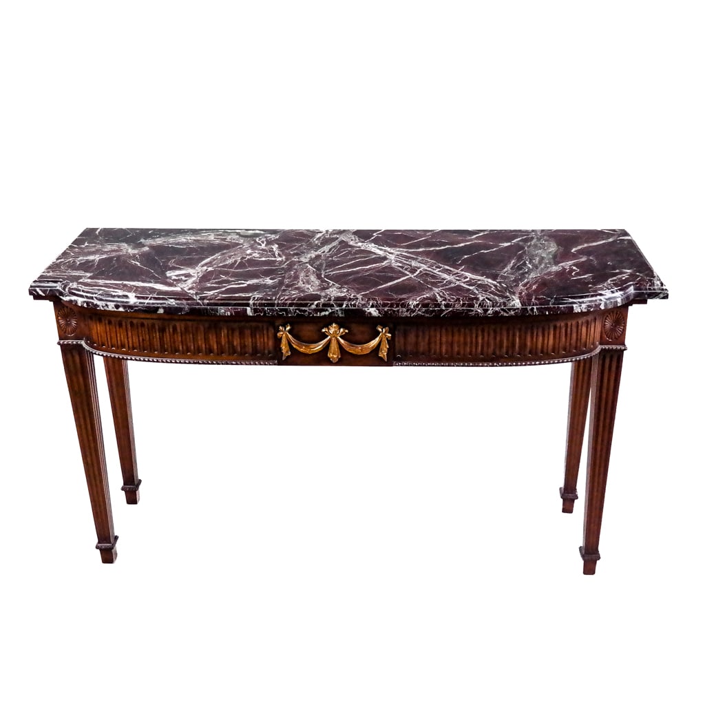 George III-Style Console Table: Smith & Watson George III-style console table with carved conforming marble top over the bowed base, with Neoclassical swag details. [36" H x 62" W x 23" D].
