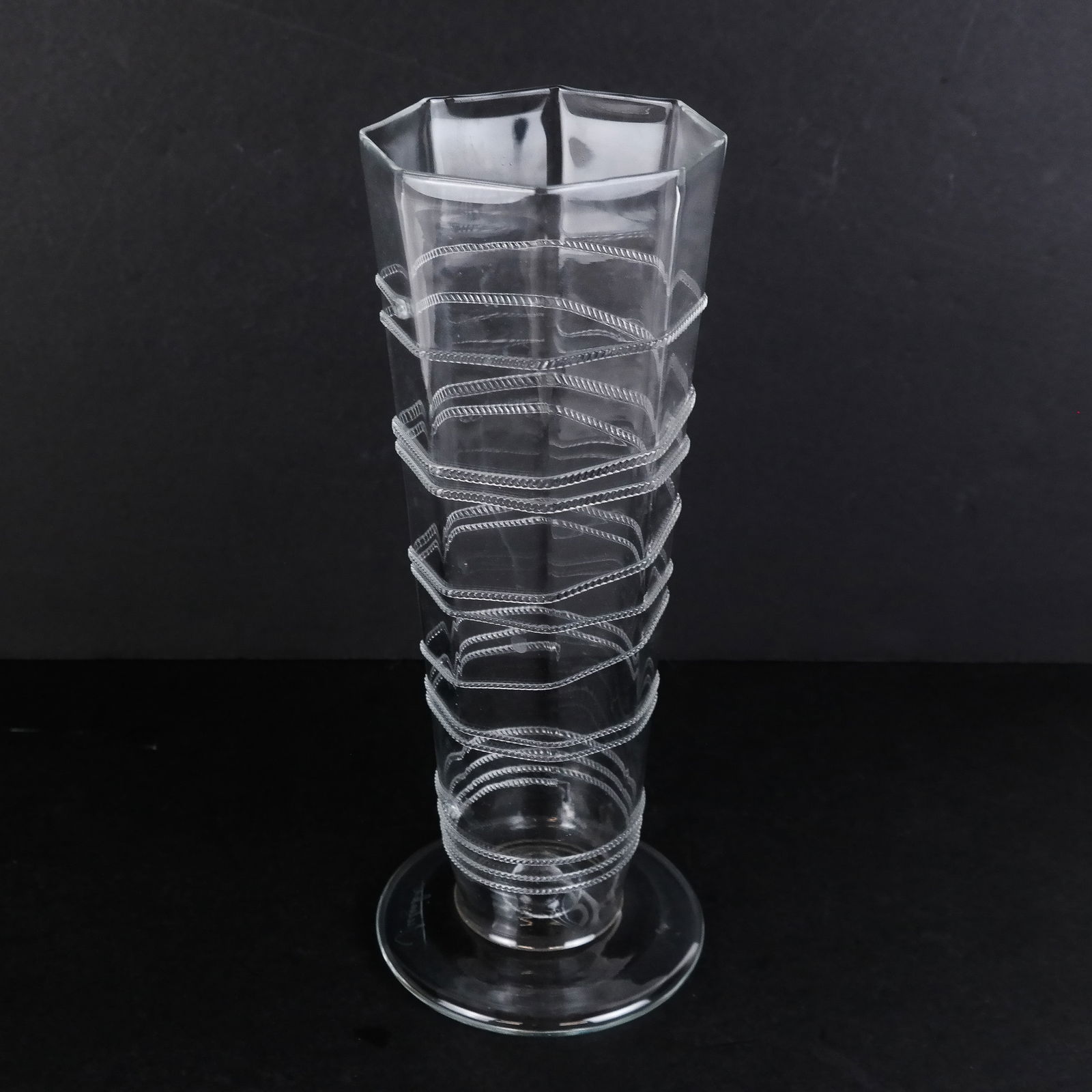 Juliska Modern Bohemian Glass Vase: Juliska modern Bohemian glass vase with ascending rope-motif detail, bearing etched signature to base. [10 1/2" H x 4 1/4" Diam.].
