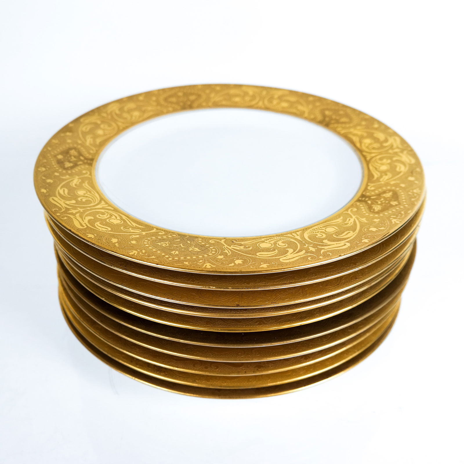 Black Knight Gilt-Decorated Dinner Plates (10): Ten (10) Black Knight dinner plates, the wide border gilt decorated with Arts & Crafts-inspired pattern. [10 3/4" Diam.].