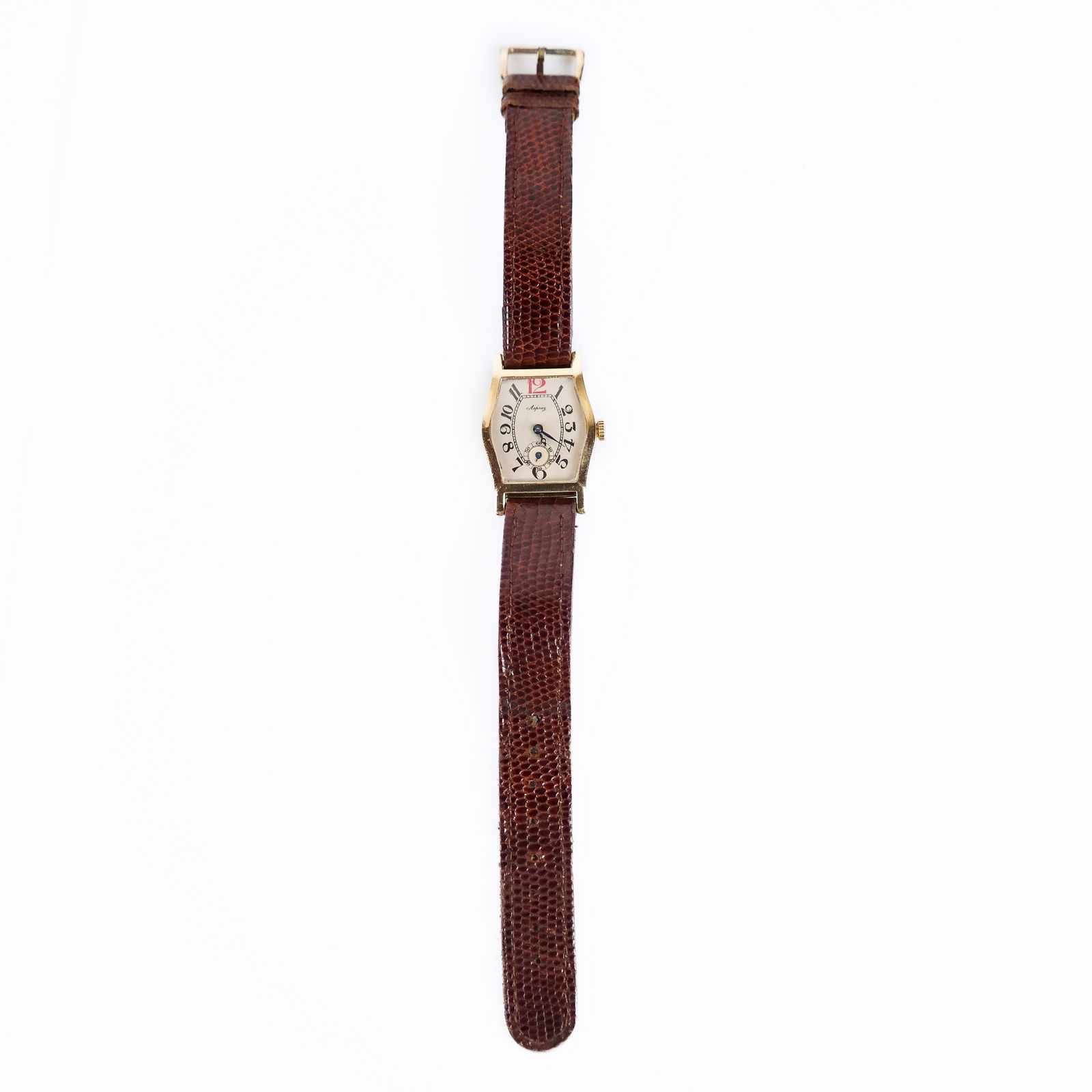 Asprey 18K Gold Wristwatch: Asprey 18K gold wristwatch, the case of stylized cartouche form, with beige dial and blue steeled hands, marked to interior case; attached to a leather band with rolled gold clasp. 19.0 grams. Second