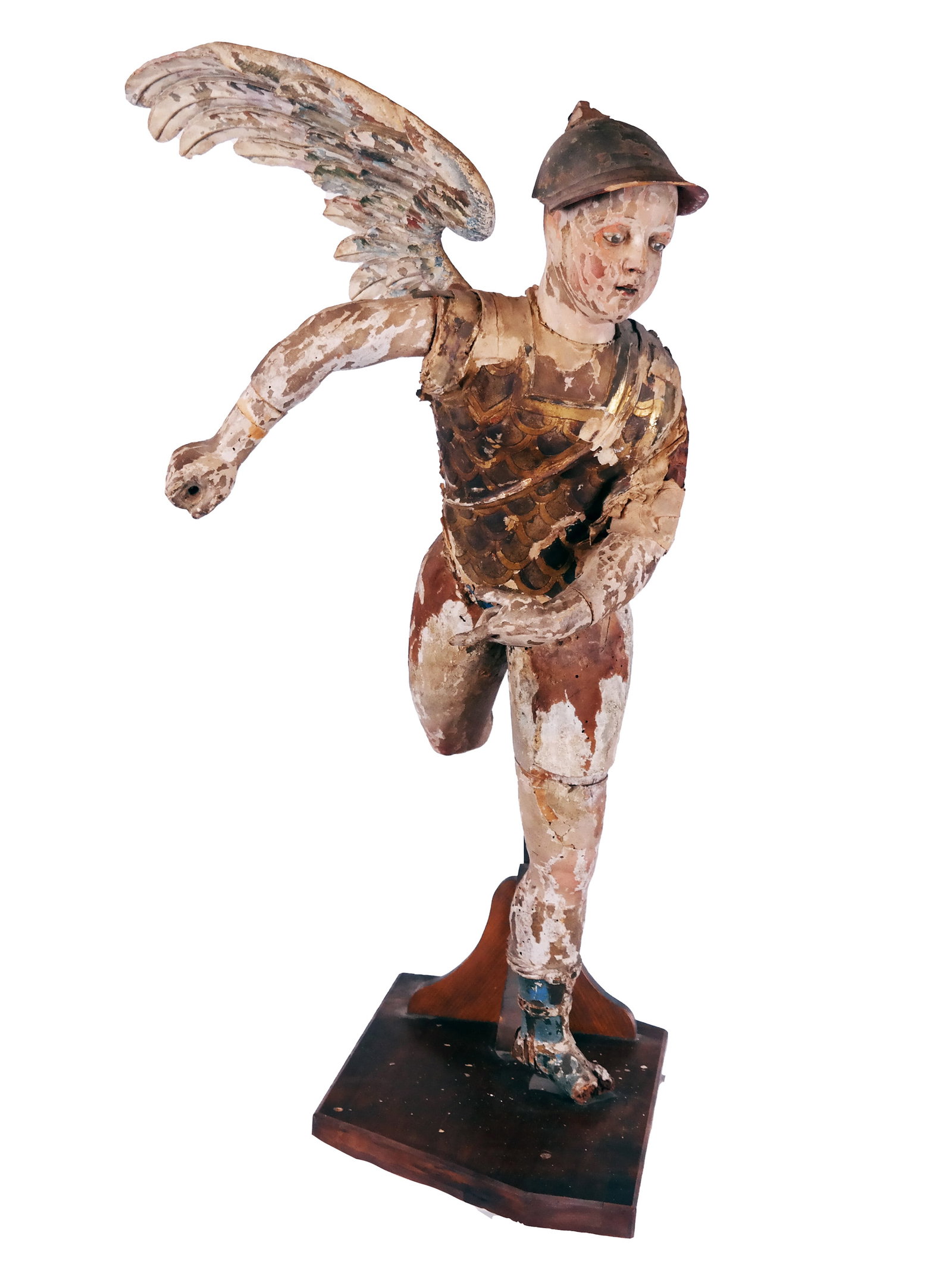17th/18th C. Spanish Colonial Wood Archangel: 17th or 18th century Spanish Colonial carved wood, gesso and polychromed archangel, in a running pose, retaining original glass eyes, mounted on an oak stand. [Sculpture only: 37" H x 20" W x 14" D]. 