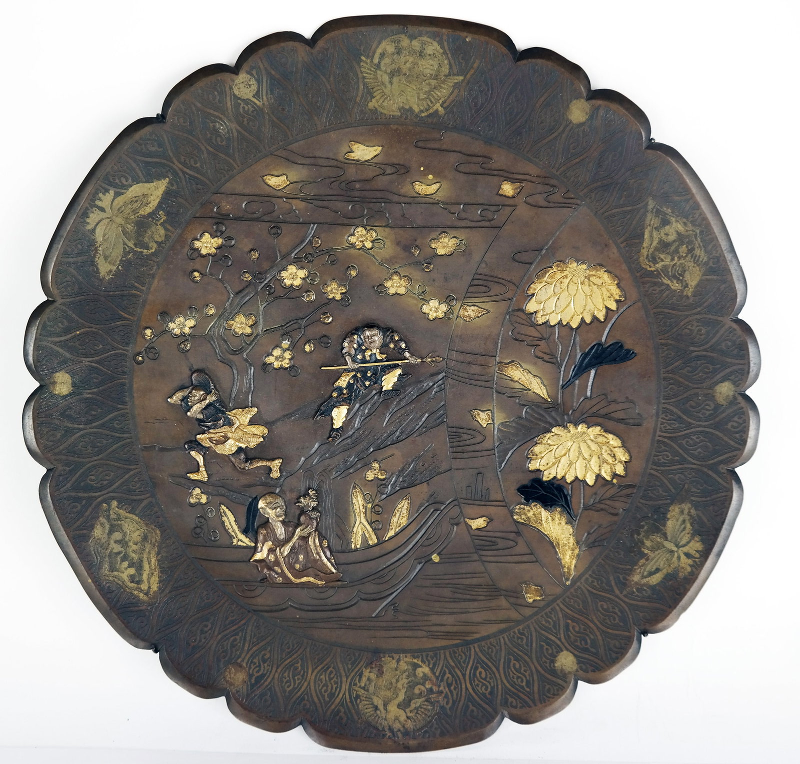 Japanese Bronze Relief-Decorated Charger: Japanese bronze relief-decorated charger, possibly Meiji, late 19th century, and in the manner of Kako (Suzuki Chokichi) and Kiyru Kosho Kaisha, with gilt-accented scene, with later metal hanger; mark