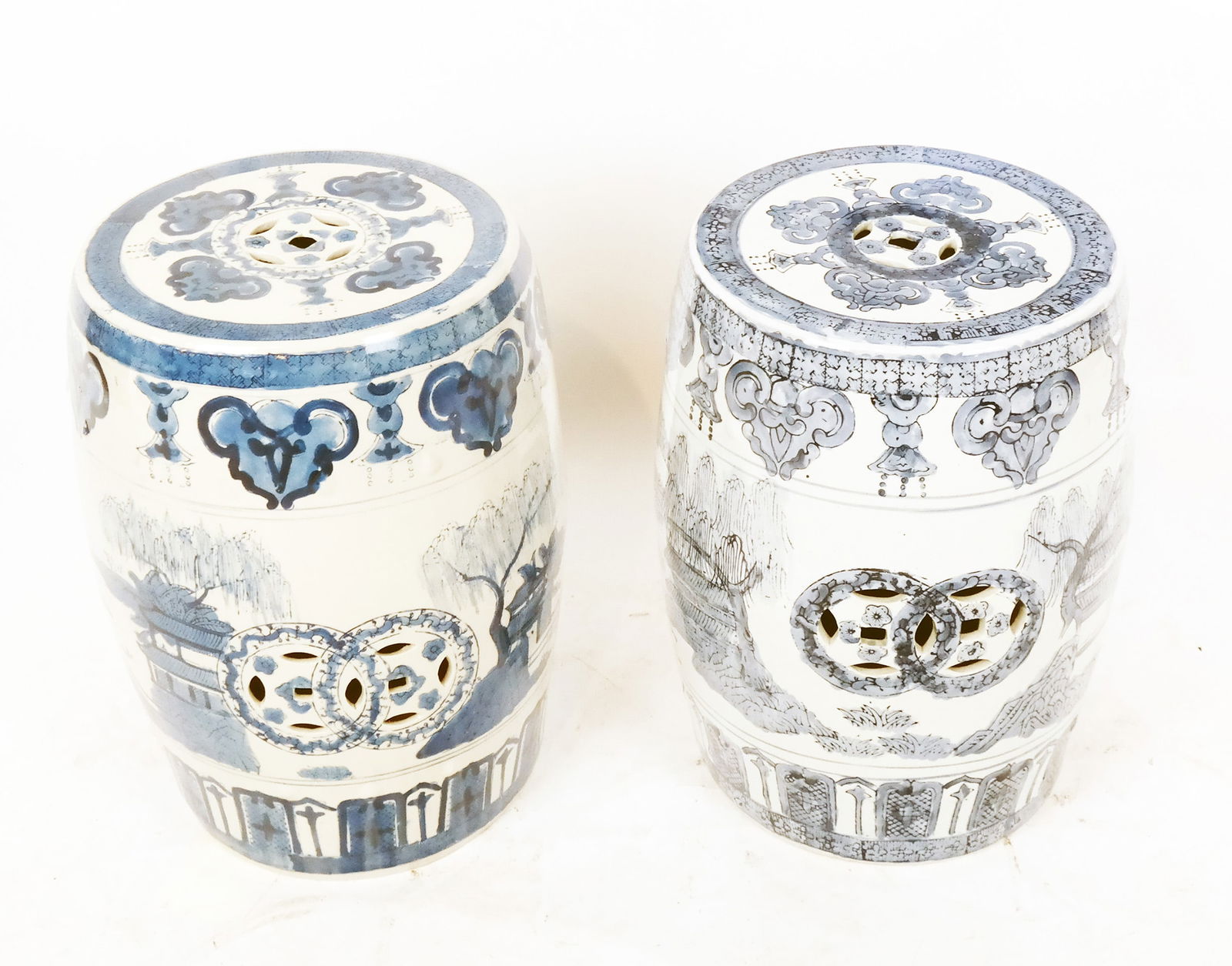 Two Blue & White Chinese Garden Seats: Two blue and white Chinese porcelain decorated garden seats. [Each: 18" H x 11 1/2" Diam.].