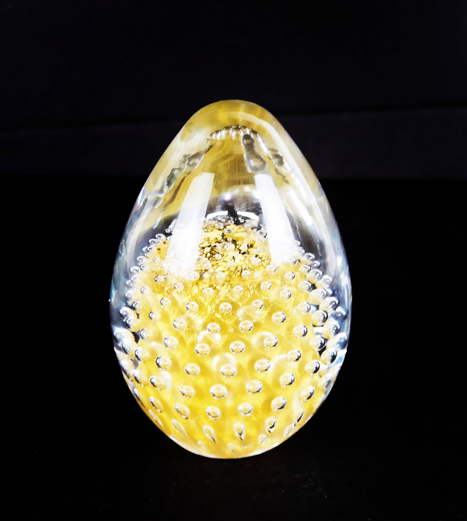 F.M. Konstglas Art Glass Paperweight: F.M. Konstglas art glass paperweight, Ronneby, Sweden, of egg form, marked to base. [4 1/2" H x 3" W]. Minor stress along rim of base.