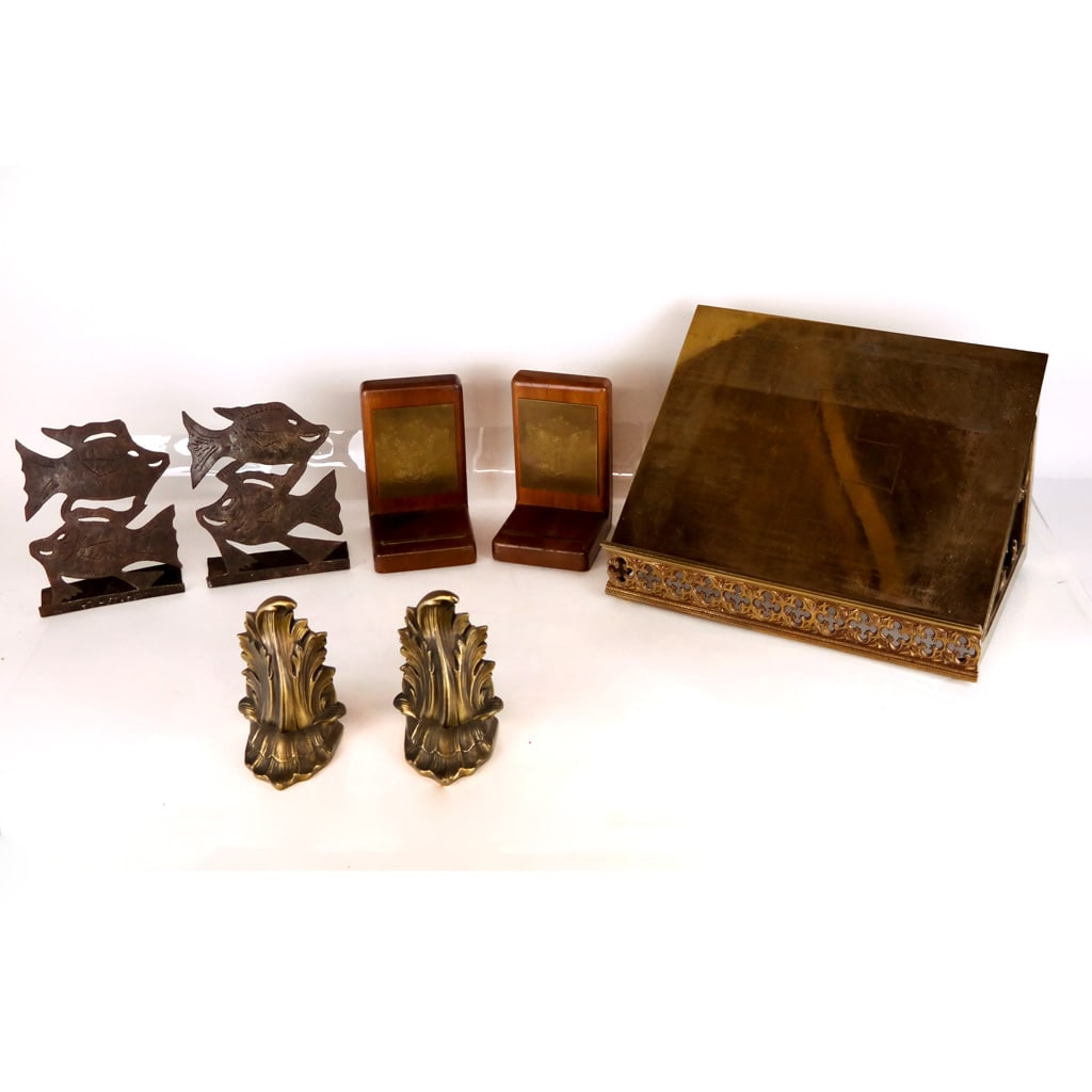 Engraved Brass Lectern and Bookends: Engraved brass lectern and bookends, the book stand with Gothic details and memorial inscription, together with bookends and fish-form doorstops. [Lectern: 9 1/2" H x 15" W x 10" D].