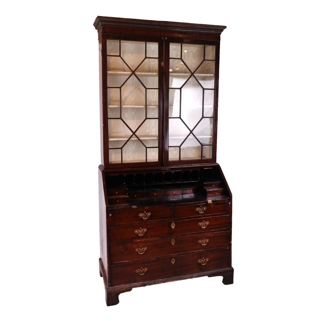 George III Mahogany Secretary Bookcase: George III mahogany secretary bookcase, early 19th century and later elements, the pair of glazed cream mullion doors above a slant-front writing desk with five drawers and cubbyholes. [94" H x 44" W 