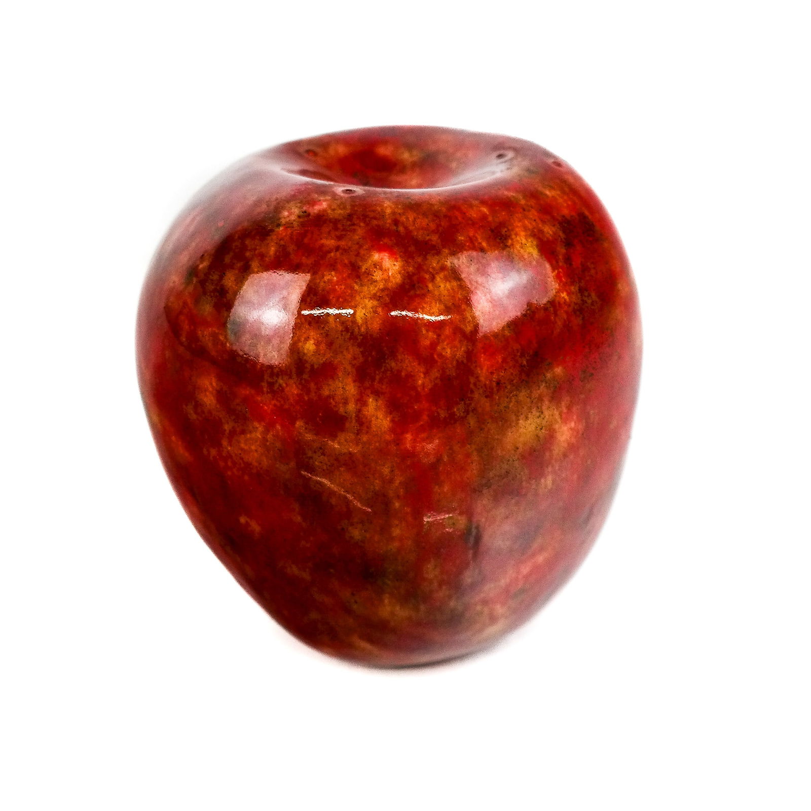 Manner of Hans Hedberg Ceramic Apple: Realistically-modeled ceramic apple in red, orange, yellow and browns, in the manner of Hans Hedberg, marked to base. [4 3/4" x 4 3/8"].