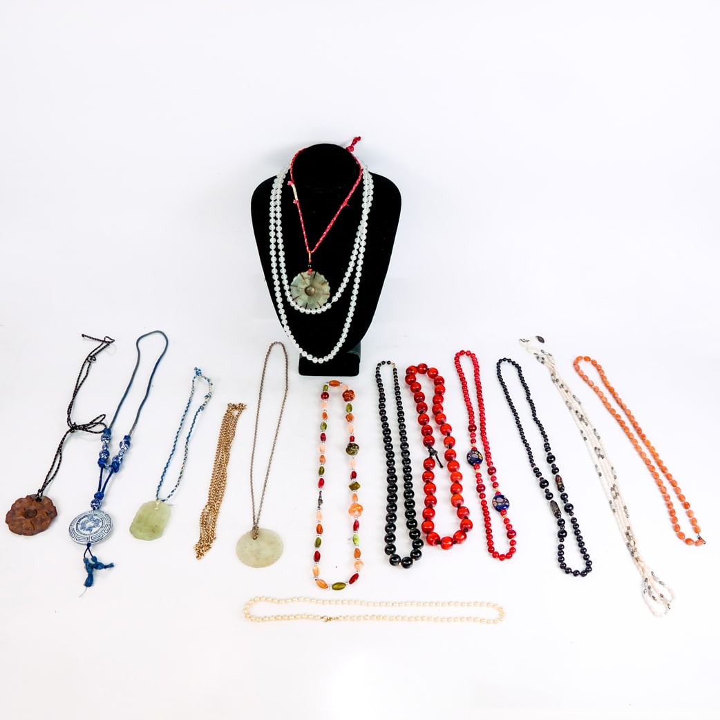 Assorted Costume Jewelry Necklaces: Assorted costume jewelry necklaces, some with Orientalist pendants of jade and porcelain.