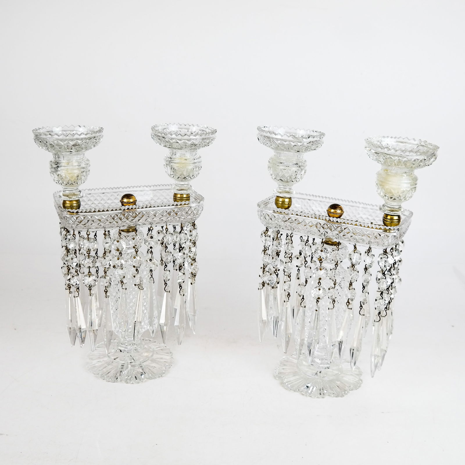 Pair of Vintage Victorian-Style Glass Lustres: Pair of vintage Victorian-style glass lustres, each with candlesticks and faceted pendant prisms. [11 1/4" H x 7 3/4" W x 4" D].