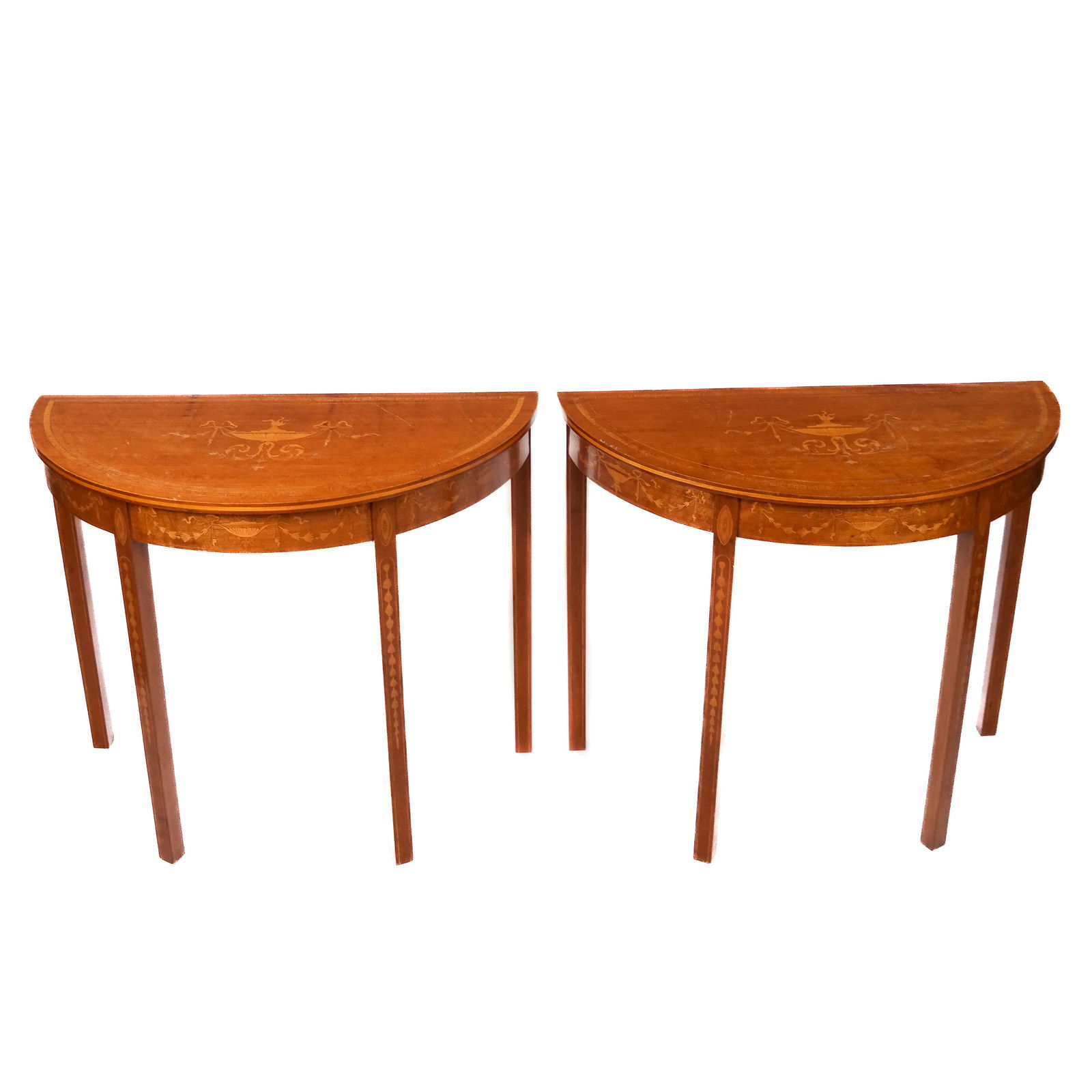 Pair of Mid-20th C. Inlaid Console Tables: Pair of marquetry-inlaid console tables with urn, ribbon and bellflower designs on the tops and the legs. [29 1/2" H x 35 1/2" W x 17 3/4" D]. Abrasions; veneer losses.