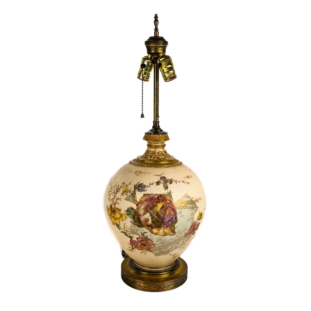 Floral and Fish Decorated Porcelain Lamp: Parcel gilt porcelain fish and flower lamp with Rococo motif accents. [26" H x 10 1/2" Diam.].
