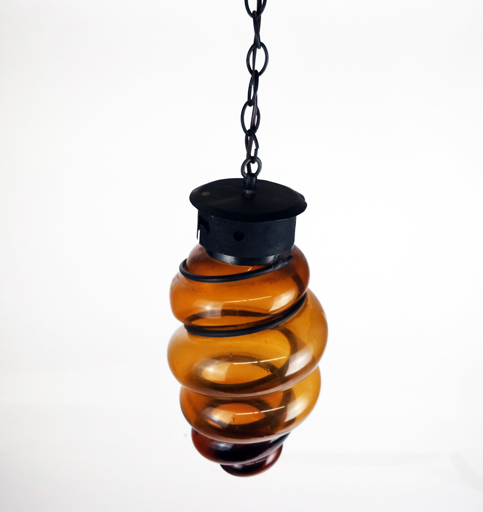 Modern Twist-Form Amber Glass Lantern: Modern twist-form amber glass lantern. [13" H].
