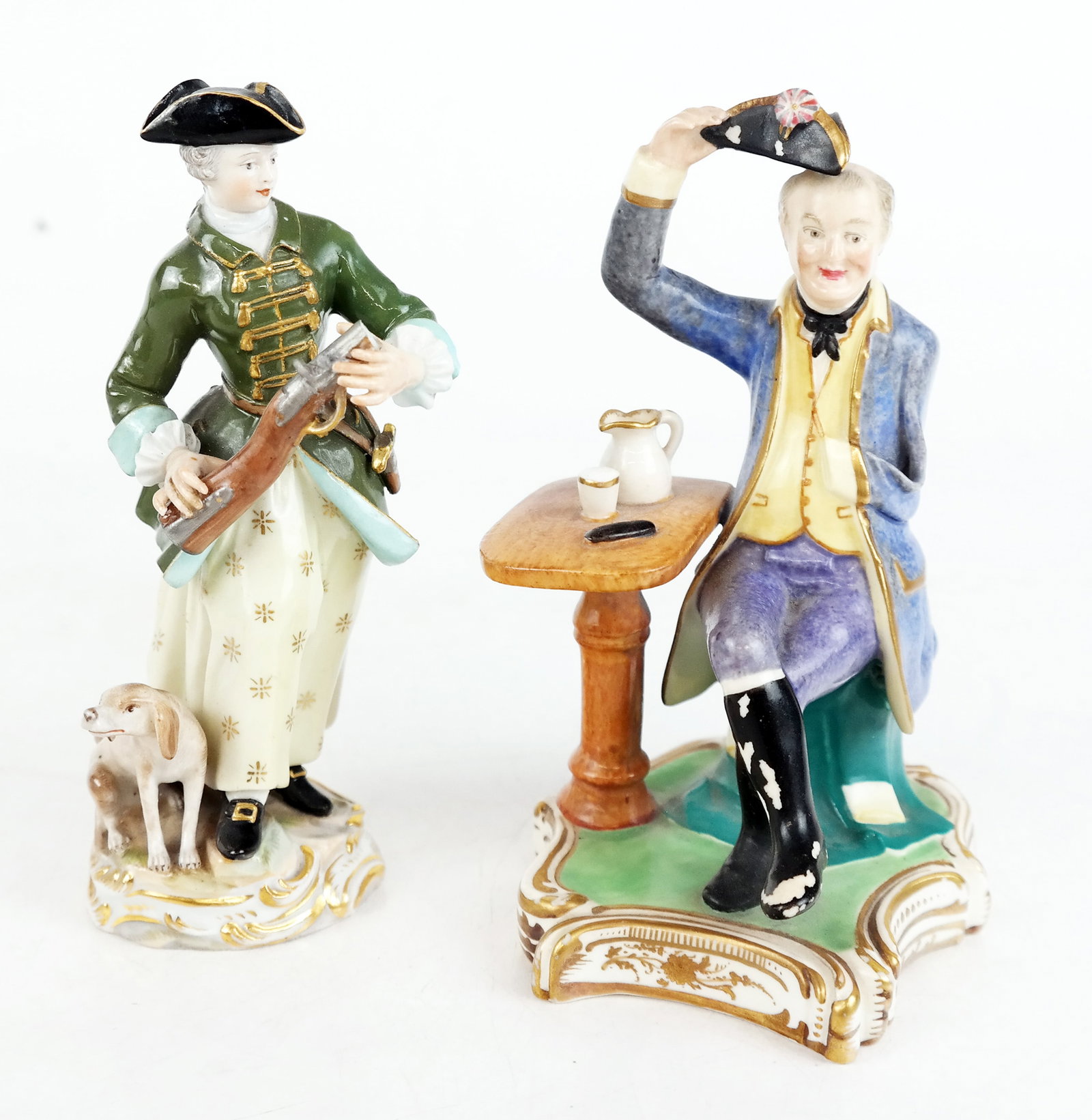 Meissen and Other - Porcelain Sculptures (2): A Meissen figure of a hunter and his dog (rifle broken), and a porcelain figure of Napoleon (paint loss). [Larger: 5 1/2" H]..