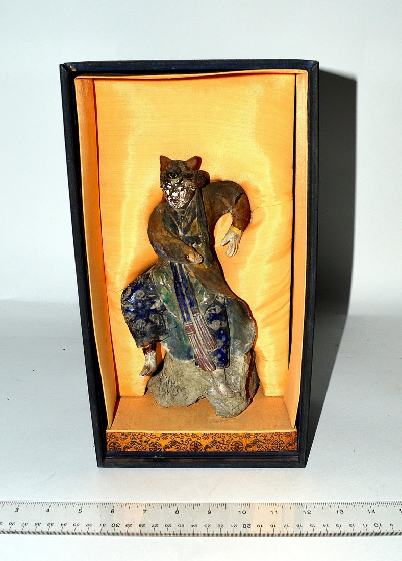 Japanese Glazed Earthenware Dancing Figure: Depicts a dancing male figure with horn headdress. As is. Losses and wear. Figure 9H. Shadow box 7 1/4" x 6" x 13'."