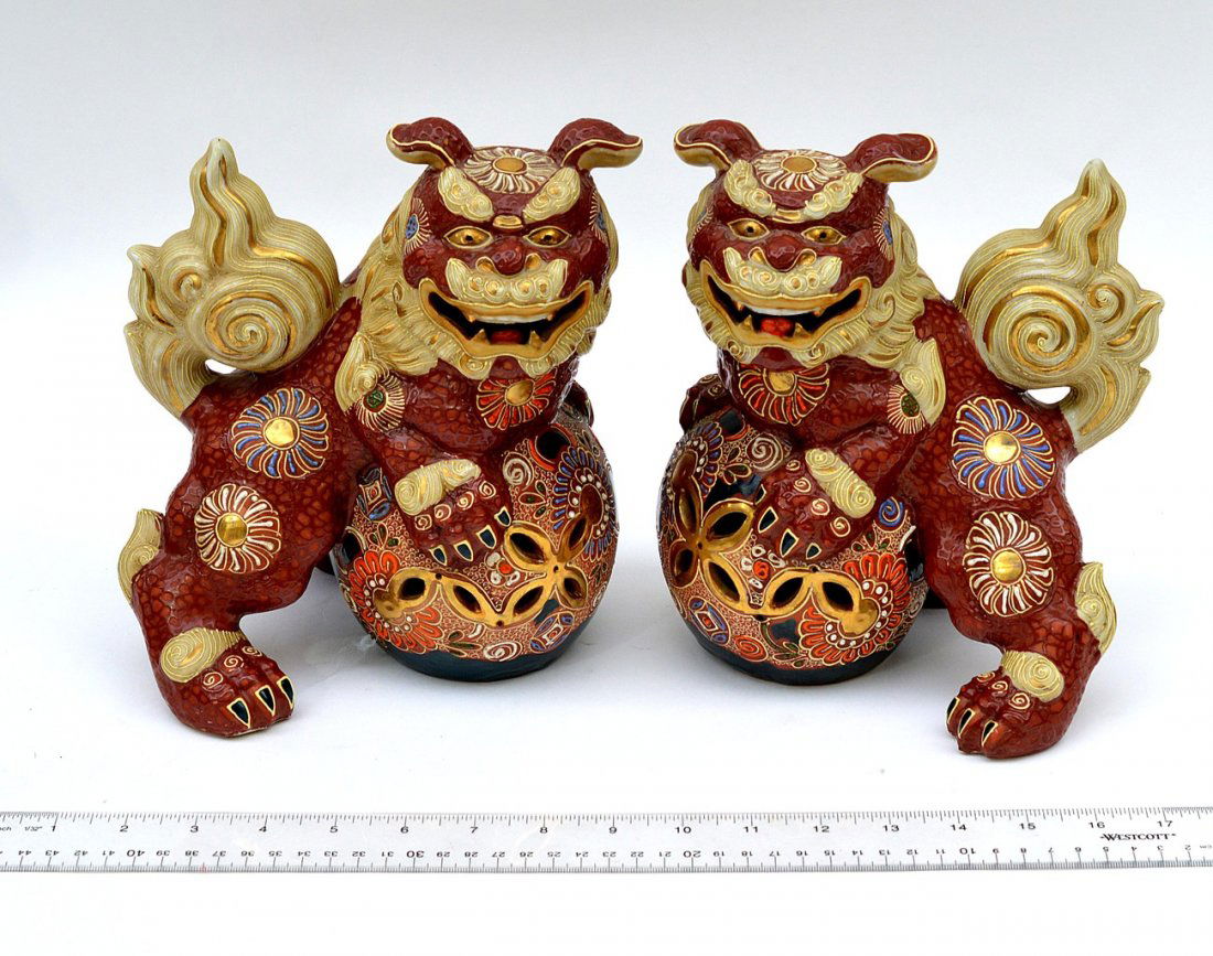 Pair of Japanese Foo Dogs: Glazed Earthenware Foo Dogs with gilt accents. 7 1/2 W x 6 1/2" D x 9" H. Good Condition."