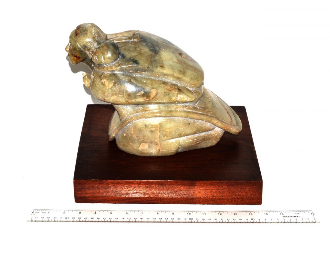 Inuit Sculpture - Mother and Child: Inuit soapstone depicting mother and child. 12 1/2" x 6 1/2" x 8"H. Minor chips.