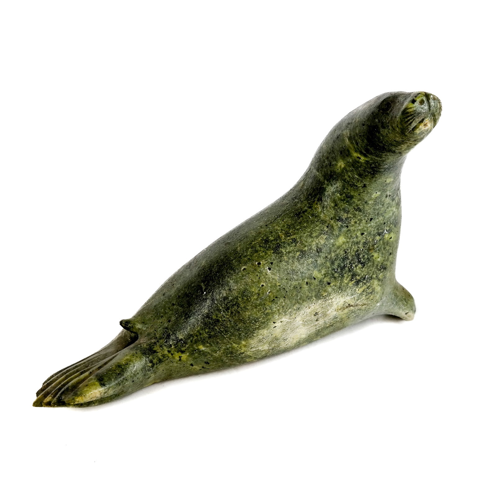 Inuit Sculpture of a Seal: Inuit sculpture of a seal. [9 1/2" H x 13 1/2" W x 4 1/2" D]. In good condition.