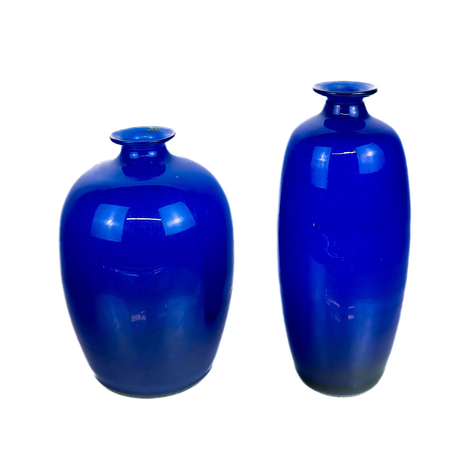 Two Scandinavian Art Glass Vases: Two cobalt blue art glass vases marked "Plus Norway" at base, circa 1970s. [10 1/2" H x 4 1/2" Diam.; 9" H x 6 1/2" Diam.]. In good condition with no chips; small blemish at lip of shorter vase. Condi