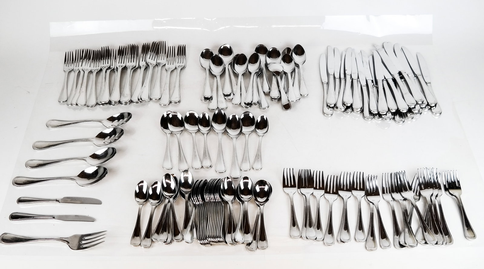 Reed and Barton Stainless Flatware Set: Reed & Barton stainless steel flatware set, Korea. Condition reports and requests for additional photos cannot be accepted on this lot; please bid accordingly. This is not an indication of good or bad