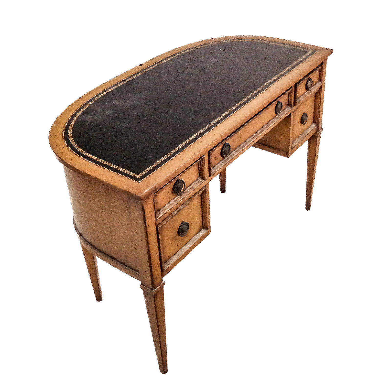 American 20th C. Fruitwood Desk: American fruitwood black tooled leather desk with bow front, raised on square tapered legs. [29 1/2" H x 43" W x 21" D].