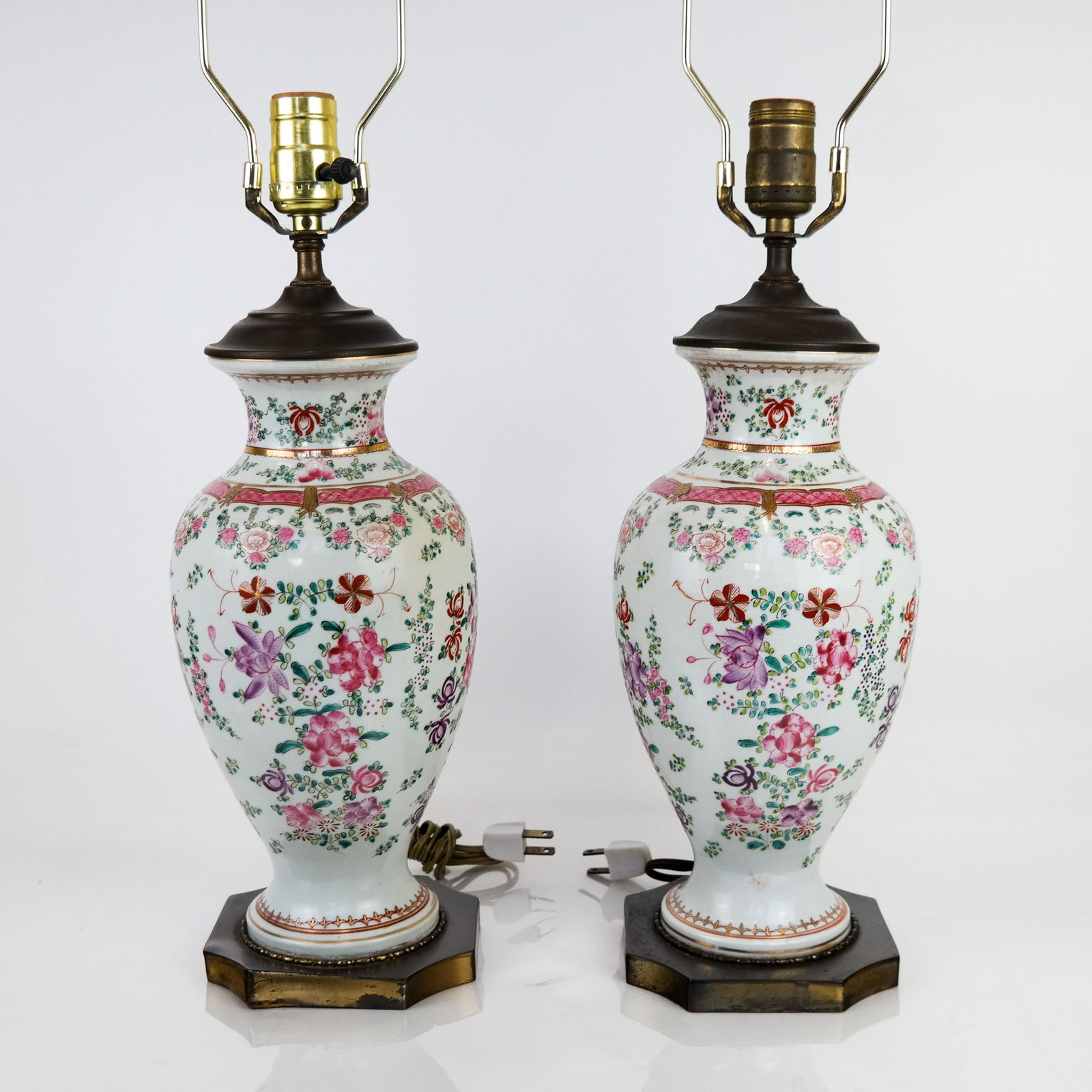 Pair of Chinese Export Vases Mounted as Lamps: Pair of Chinese Export famille rose porcelain vases, 20th century, mounted as lamps, with gilt metal bases and caps. Condition reports and requests for additional photos cannot be accepted on this lot