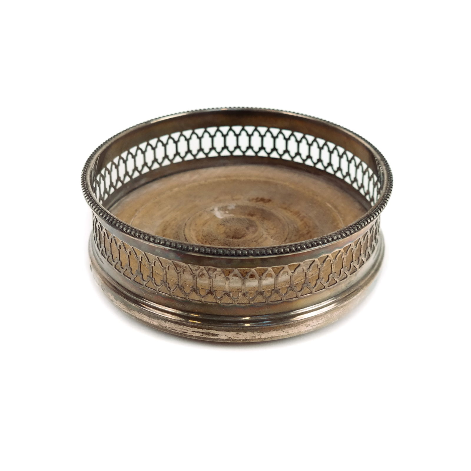 English Silver Wine Coaster: English silver wine coaster, marked for James Robinson, London, 1978. [1 5/8" H x 5 1/8" Diam.]. Condition reports and requests for additional photos cannot be accepted on this lot; please bid accordi