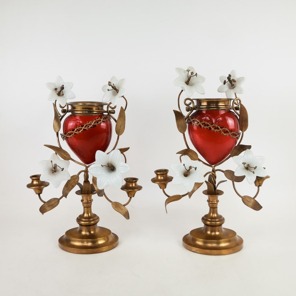 Pair of French Votive Lamps: Pair of 20th century French brass and glass votive lamps with red glass bleeding hearts and white glass flowers. Condition reports and requests for additional photos cannot be accepted on this lot; pl