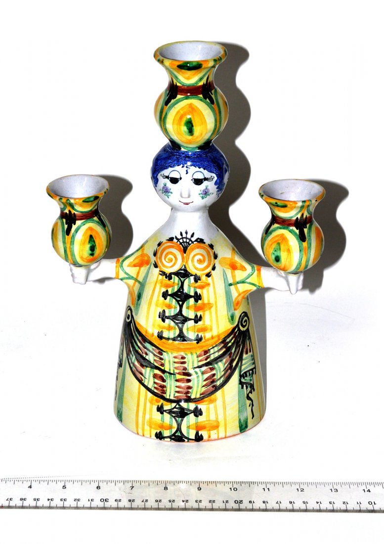 Bjorn Wiinblad Figural Candelabra: Wiinblad candelabra having three candleholders. Marked "L8...86...Danmark" on bottom. 8 1/4" x 4" D x 12" H. Very good condition.