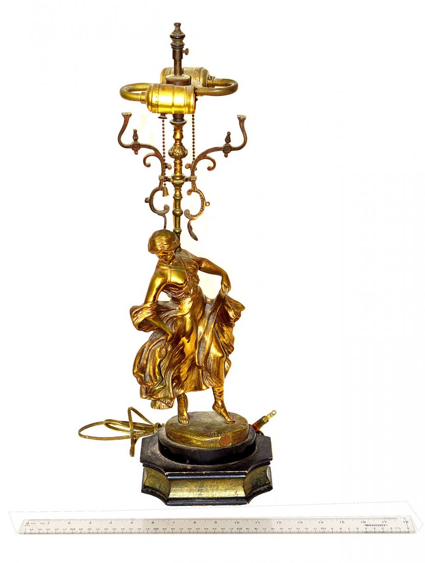 J.M. Picciole Bronze Figure Mounted as Lamp: Depicts a dancing peasant girl on stepped ebonized wood base. Figure: 11" H. Overall: 7"W x 5"D x 23"H to finial