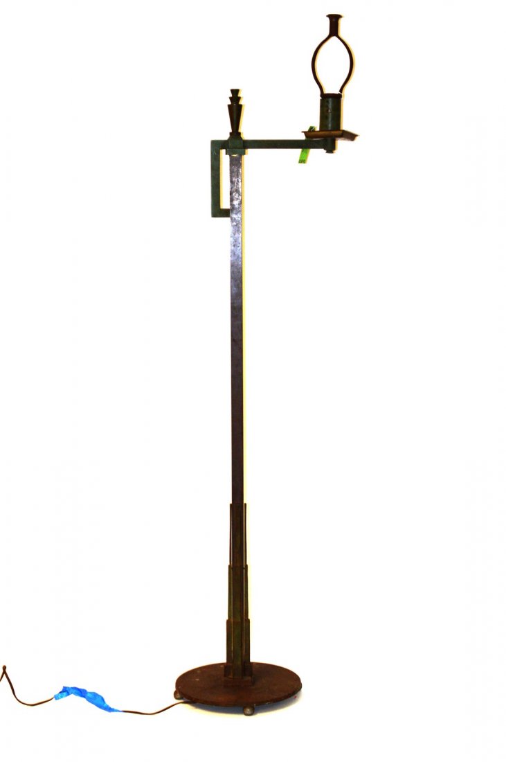Art Deco Skyscraper Style Floor Lamp: Bronze, iron, and copper flor lamp on circular base with stepped skyscraper style elements at bottom. Features dark brown and green patination. 11 3/4" D x 11" Dia. at base x 50 1/2" to socket. Needs 