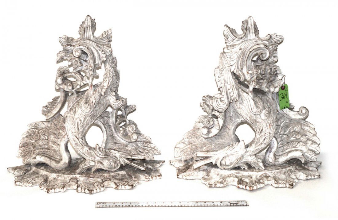 Pair of Bird Form Brackets: Pair of ornate painted brackets with bird and floral motif. Overall good condition. 21" x 21".