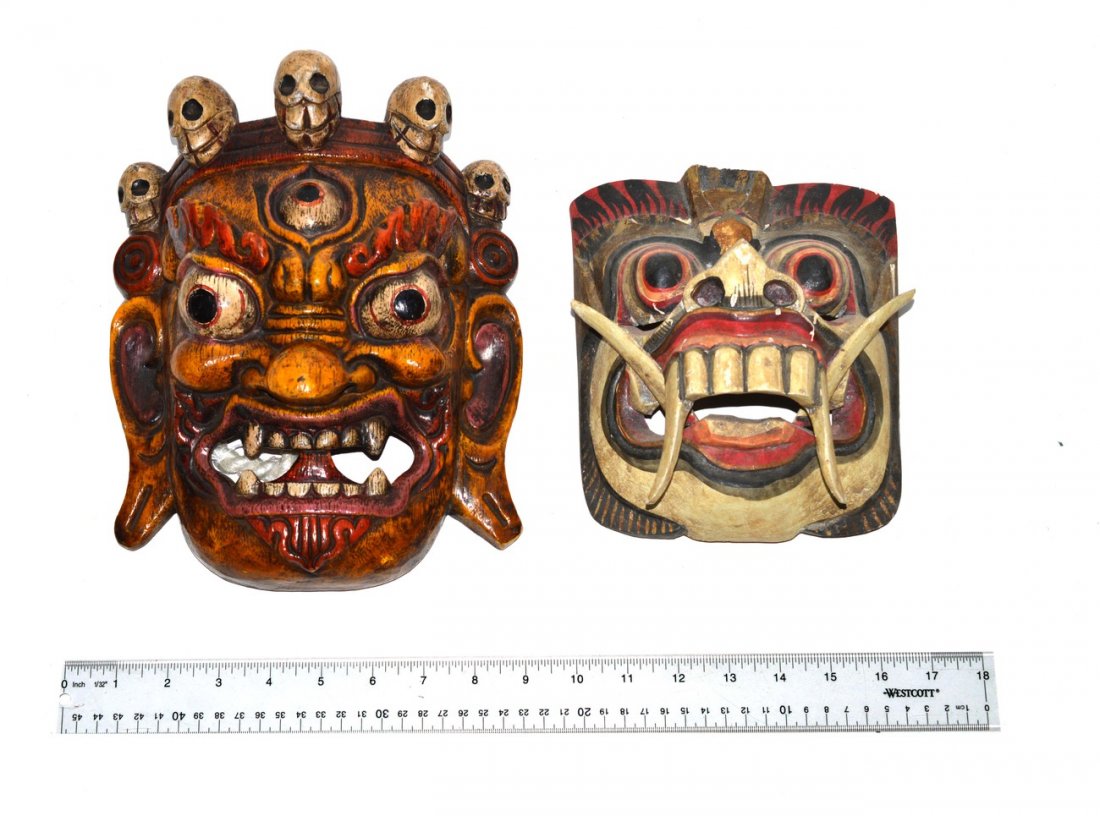 Two Decorated Masks: One with skulls, the other with horns. 11" H [tallest].