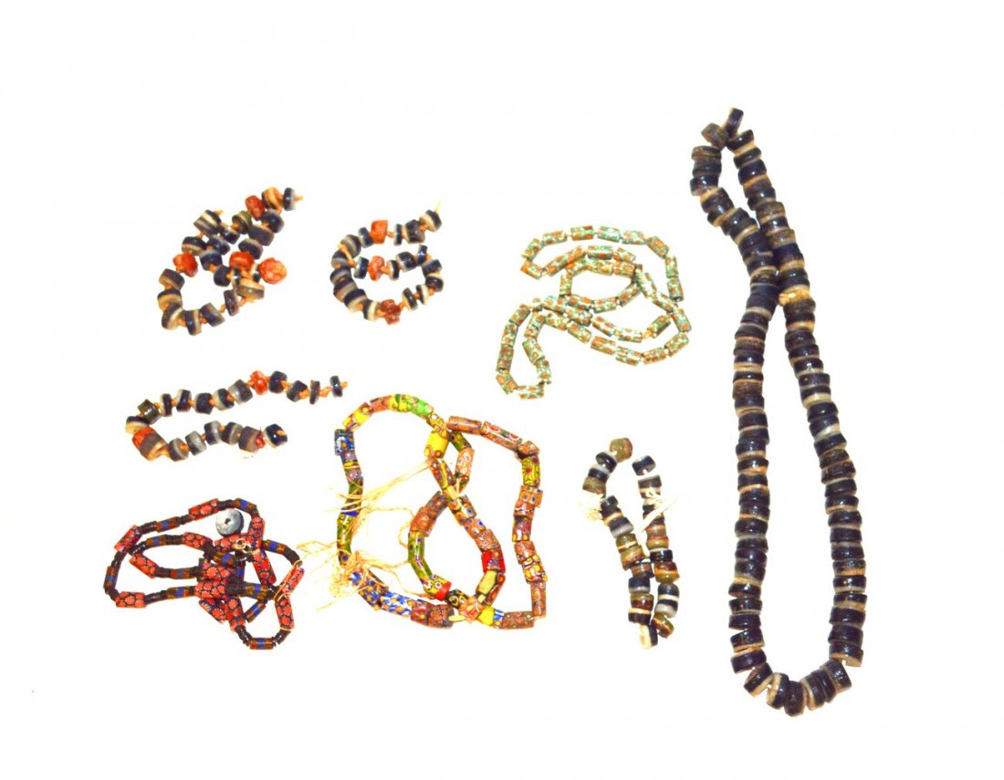 Antique African Trade Beads: Ceramic and glass beads comprising of ten millefiori strands and six two tone strands.
