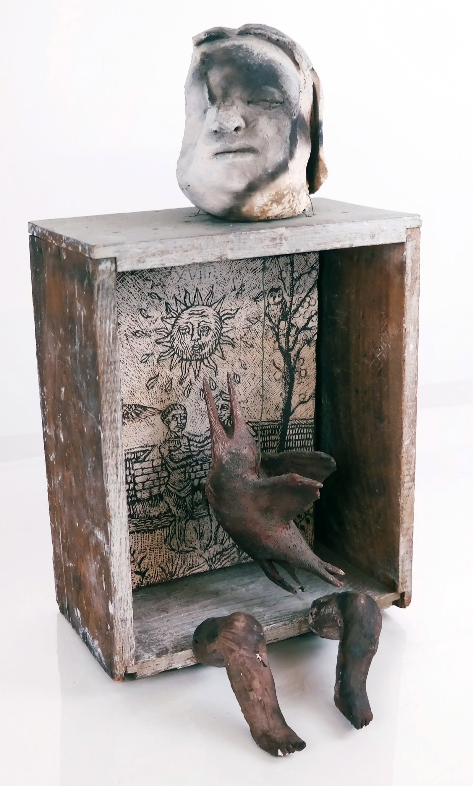 Shadowbox Style Sculpture with Sun & Figures: A shadowbox style sculpture with a painting on board of a sun and figures. No apparent signature. Provenance: From the Collection of Brendelle & Fred Walden. [Approximately: 21" H x 9 1/2" W x 5 1/2" 